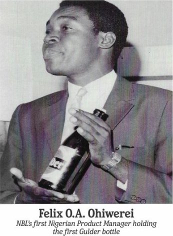 Felix O. A. Ohiwerei, NBL&rsquo;s first Nigerian Product Manager, holding the first Gulder bottle